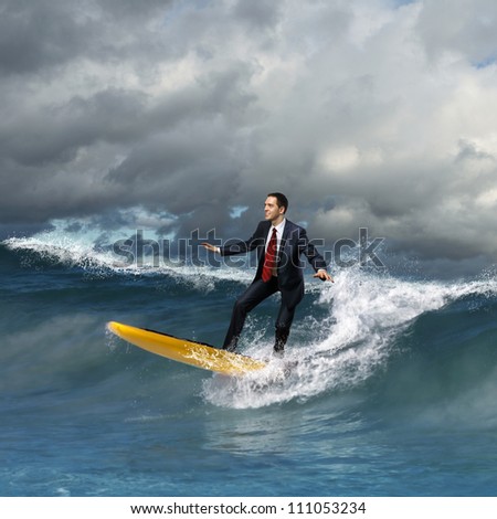 Image of young business person surfing on the waves of the ocean Image of young business person surfing on the waves of the ocean