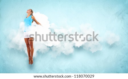 Portrait of a dancing young woman with white cloudy smoke around