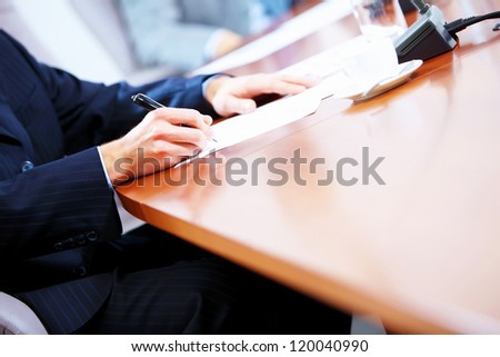 Image of a business work place with papers on the table