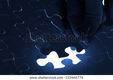 puzzle piece coming down into its place