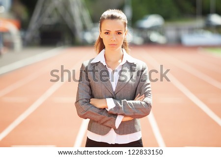 Businesswoman sport manager and executive at athletic stadium and race track