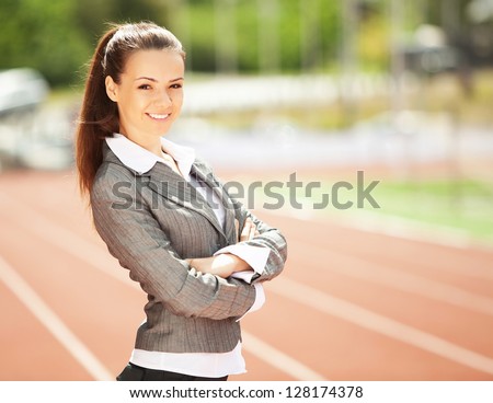 Businesswoman sport manager and executive at athletic stadium and race track