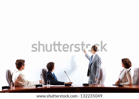 Image of businesspeople at presentation looking at screen Space for advertisment Image of businesspeople at presentation looking at screen Space for advertisment