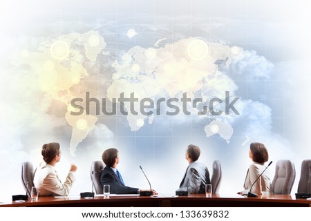 Image of businesspeople at presentation looking at virtual project