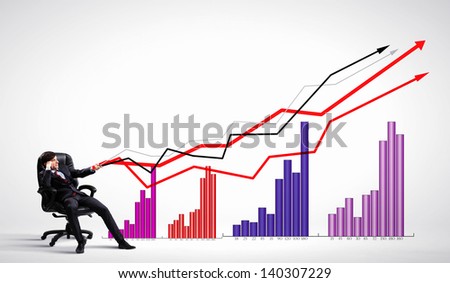 Image of young businessman pulling graph. Chart growth concept