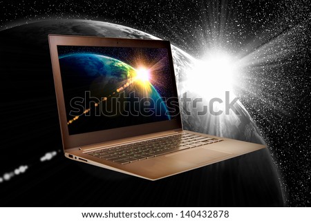 Notebook with our planet earth against black background with globe