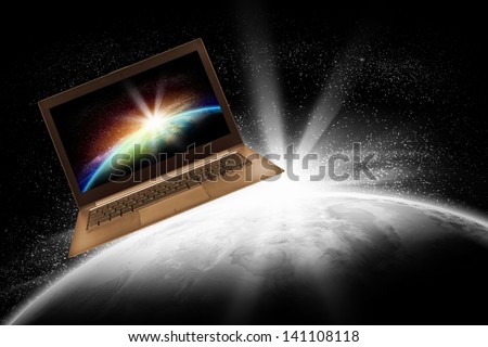 Notebook with our planet earth against black background with globe