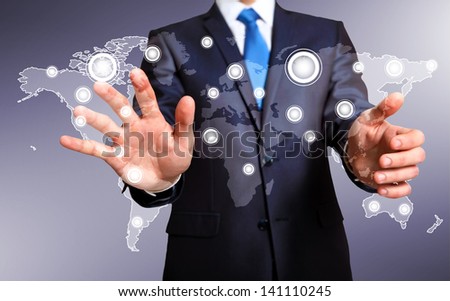 Businessman in suit pressing social media icon