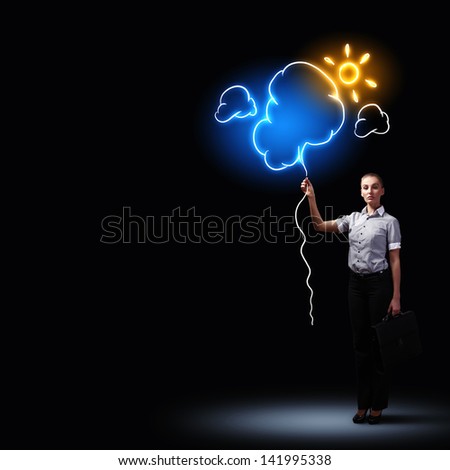 Image of attractive businesswoman against dark background