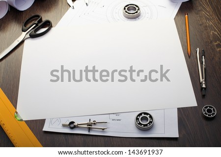 Tools and papers with sketches on the table Tools and papers with sketches on the table