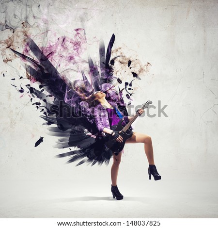 Young attractive rock girl playing the electric guitar Young attractive rock girl playing the electric guitar