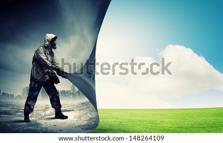 Image Of Man In Gas Mask Turning Page. Ecology Concept