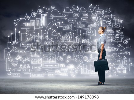 Side view image of businesswoman standing against business sketch