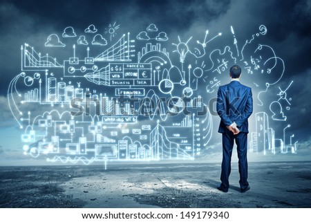Back view image of young businessman standing against business sketch