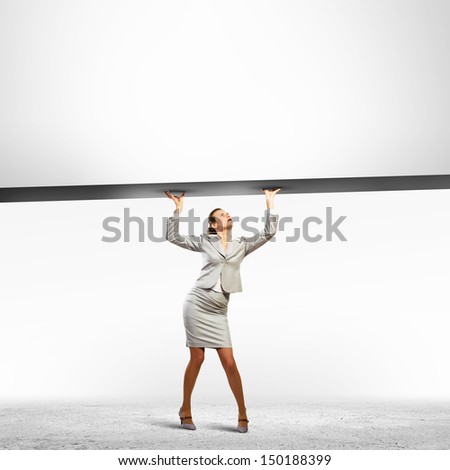 Businesswoman holding blank banner above head. Place for text