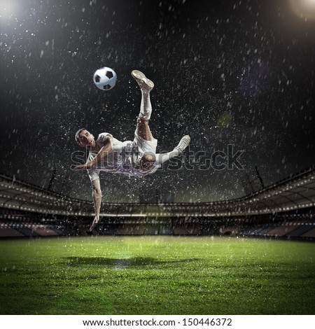 Image of football player at stadium hitting ball Image of football player at stadium hitting ball