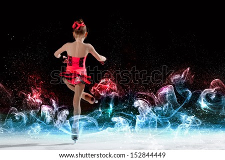 Little girl figure skating at sports arena