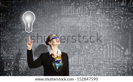 Image of businesswoman in goggles with business sketch at background. Idea concept