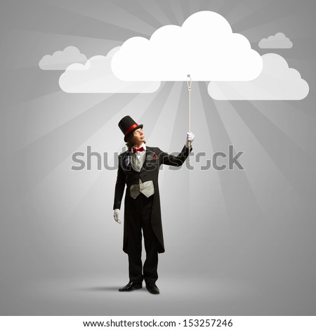 Image of wizard in hat catching clouds