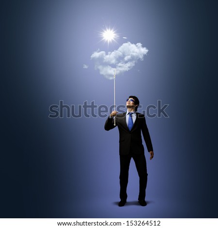 Image of businessman in goggles looking at sun