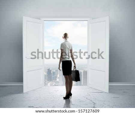 Image Of Businesswoman Standing In Front Of Opened Door