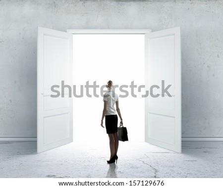 Image Of Businesswoman Standing In Front Of Opened Door