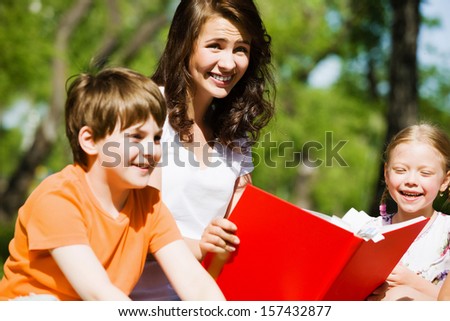 Image of children with nurse playing in park