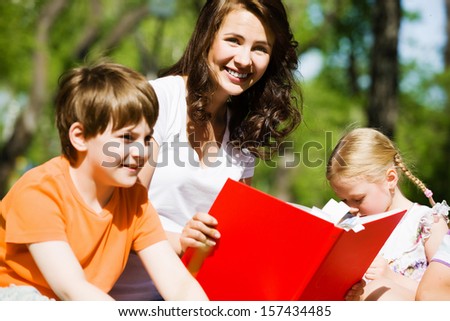 Image of children with nurse playing in park