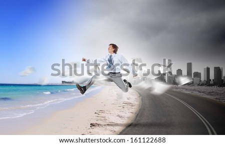 Image of businessman running away from office work