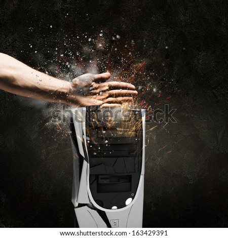 Close up image of human hand damaging computer processor