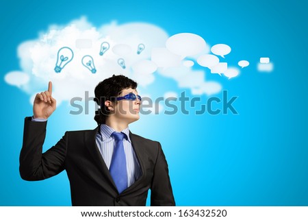 Image of young businessman with light bulbs. New idea and inspiration
