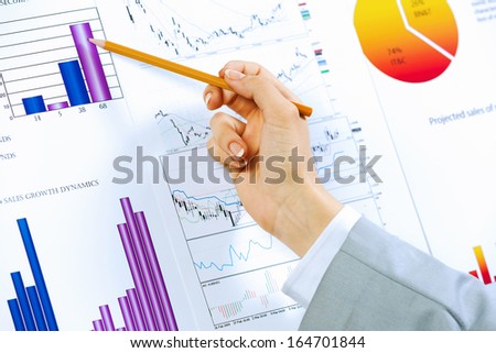 Close up image of human hand holding pencil. Marketing presentation