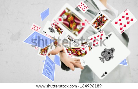 Close-up image of businesswoman throwing card deck Close-up image of businesswoman throwing card deck