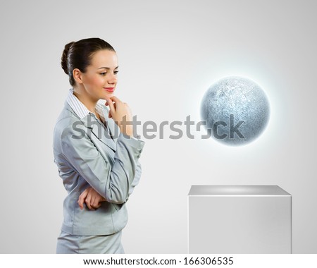 Image of businesswoman looking at moon. Astrology