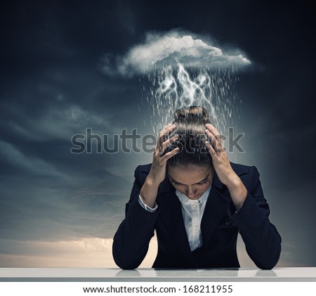Young Crying Businesswoman With Hands On Head