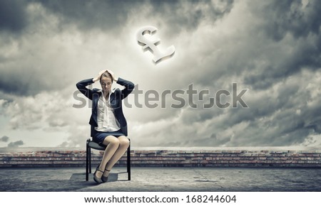Image of depressed businesswoman sitting on chair with pound sign above