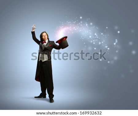 Image Of Magician Holding Hat With Lights And Fumes Going Out