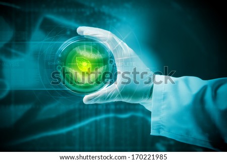 Close up image of human hand holding test tube. Science concept