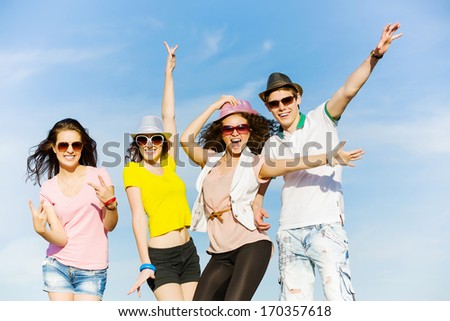 Young happy people having fun outside in summer