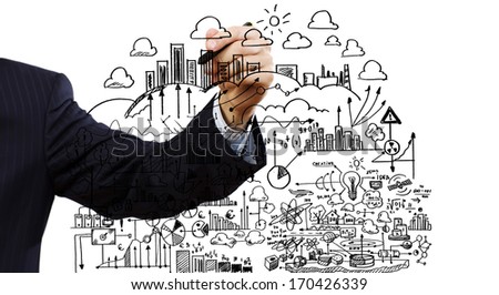 Close up of businessman drawing business sketches