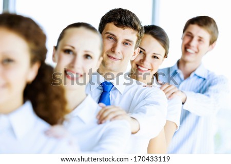 Image of young business people standing in line. Interaction concept