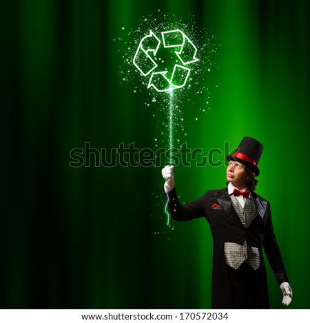Image of man magician against color background. Recycle concept