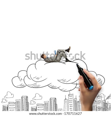 Young relaxed businessman lying on cloud and reading book
