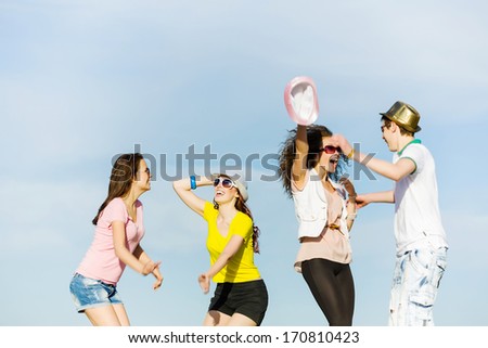 Young happy people having fun outside in summer