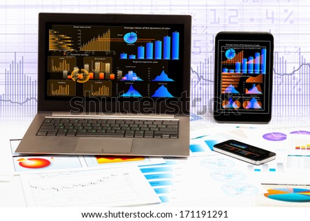 Image of ipad laptop and mobile phone with diagrams illustration
