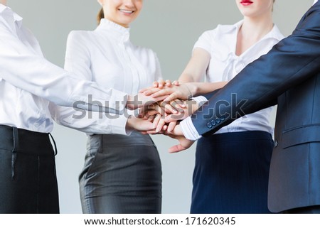 Business People Making Pile Of Hands. Partnership Concept