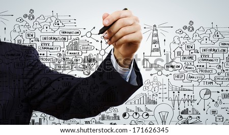Close up of businessman drawing business strategy sketch