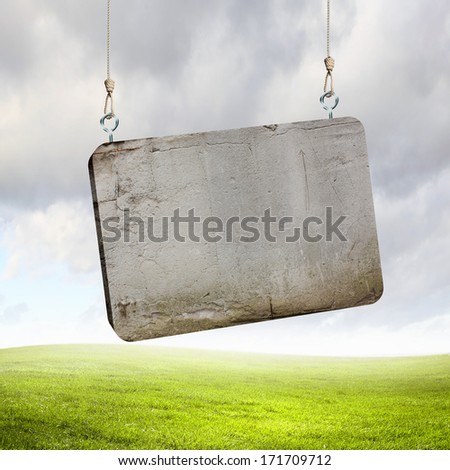 Stone blank banner hanging on ropes. Place for text