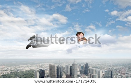 Young businessman flying in sky and playing violin