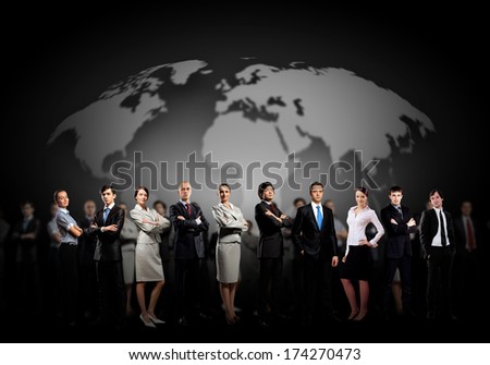 Group of businesspeople standing together against a world map background